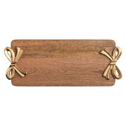 Rectangular mango wood serving board with gold cast aluminum bow handles on each side