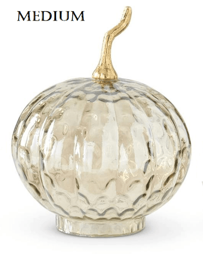 Medium amber glass pumpkin with textured wavy pattern and gold metal stem