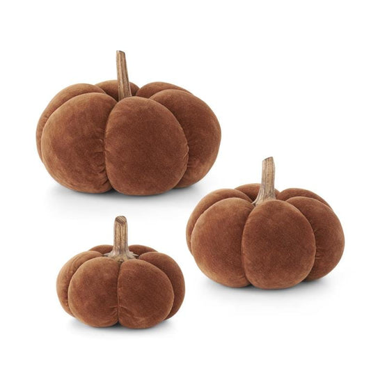 Set of three brown velvet pumpkins with natural wood stems in graduated sizes