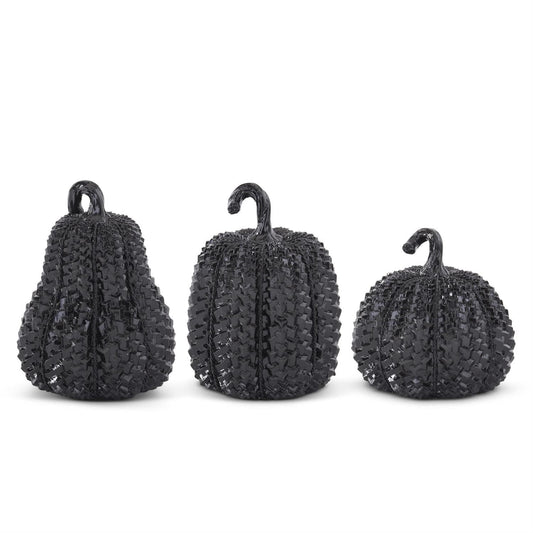 Set of three black glossy embossed resin pumpkins in small, medium, and large sizes