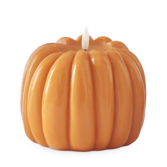Orange wax pumpkin-shaped LED candle with flickering white wick tip