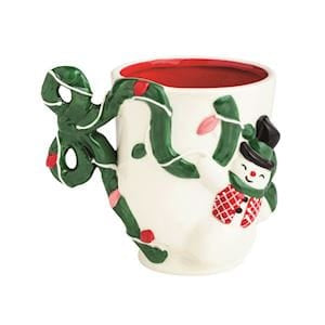 White ceramic Christmas mug with snowman figure and green bow handle, red interior