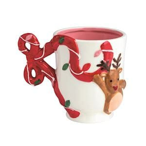 White ceramic Christmas mug with reindeer, red bow handle, and holiday lights