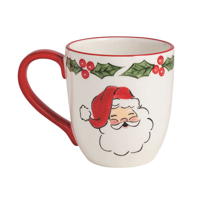 Mudpie white ceramic Christmas mug with Santa face, holly berries, and red handle