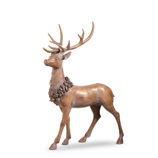 Large standing deer figurine with antlers and decorative pine cone wreath around neck, side angle view
