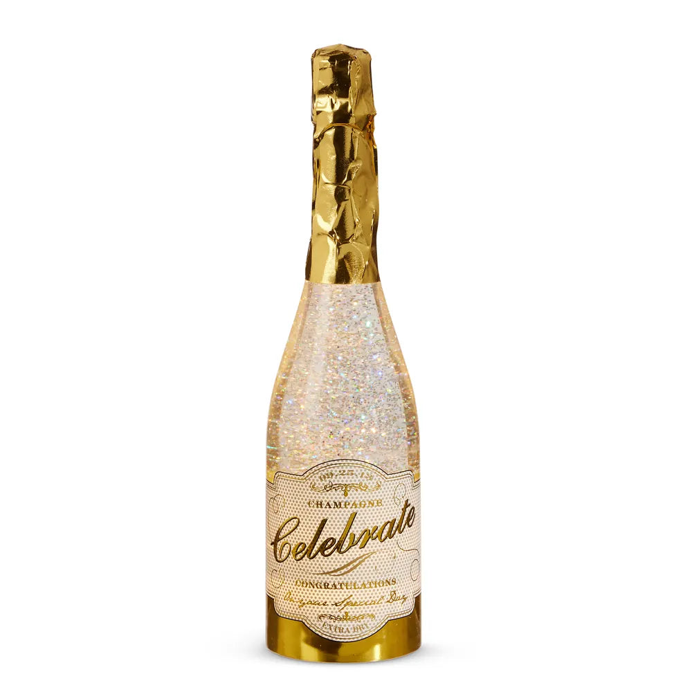 Gold foil-topped champagne bottle with swirling glitter and Celebrate label