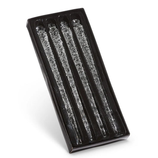 Four clear glass icicle ornaments with textured surface displayed in black gift box
