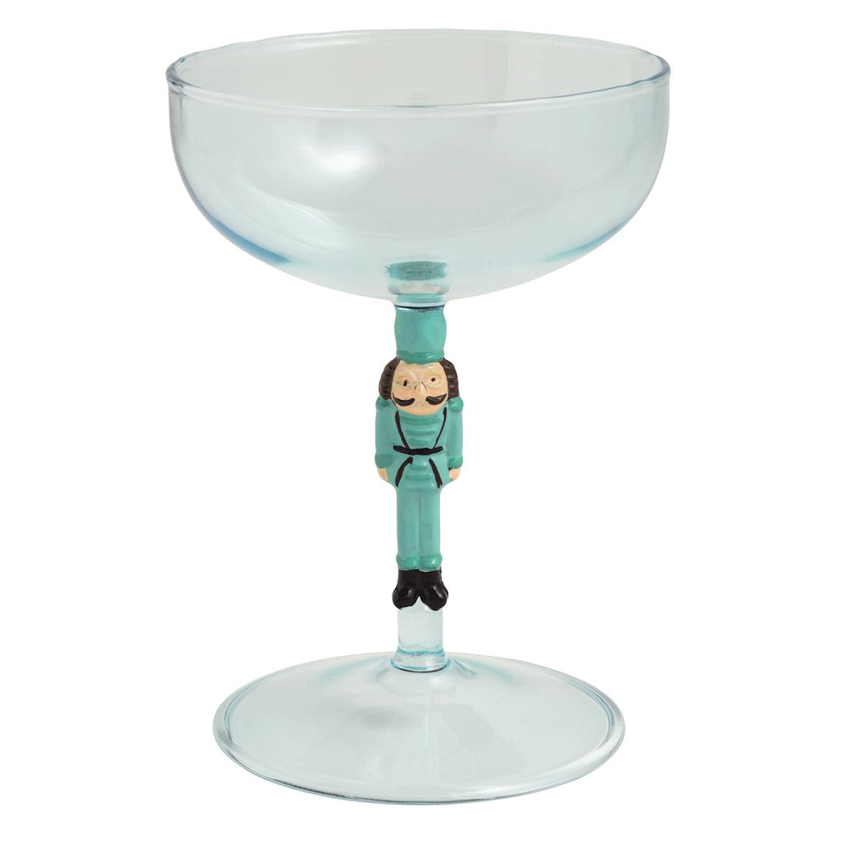 Teal coupe cocktail glass with nutcracker soldier figurine stem by Mudpie