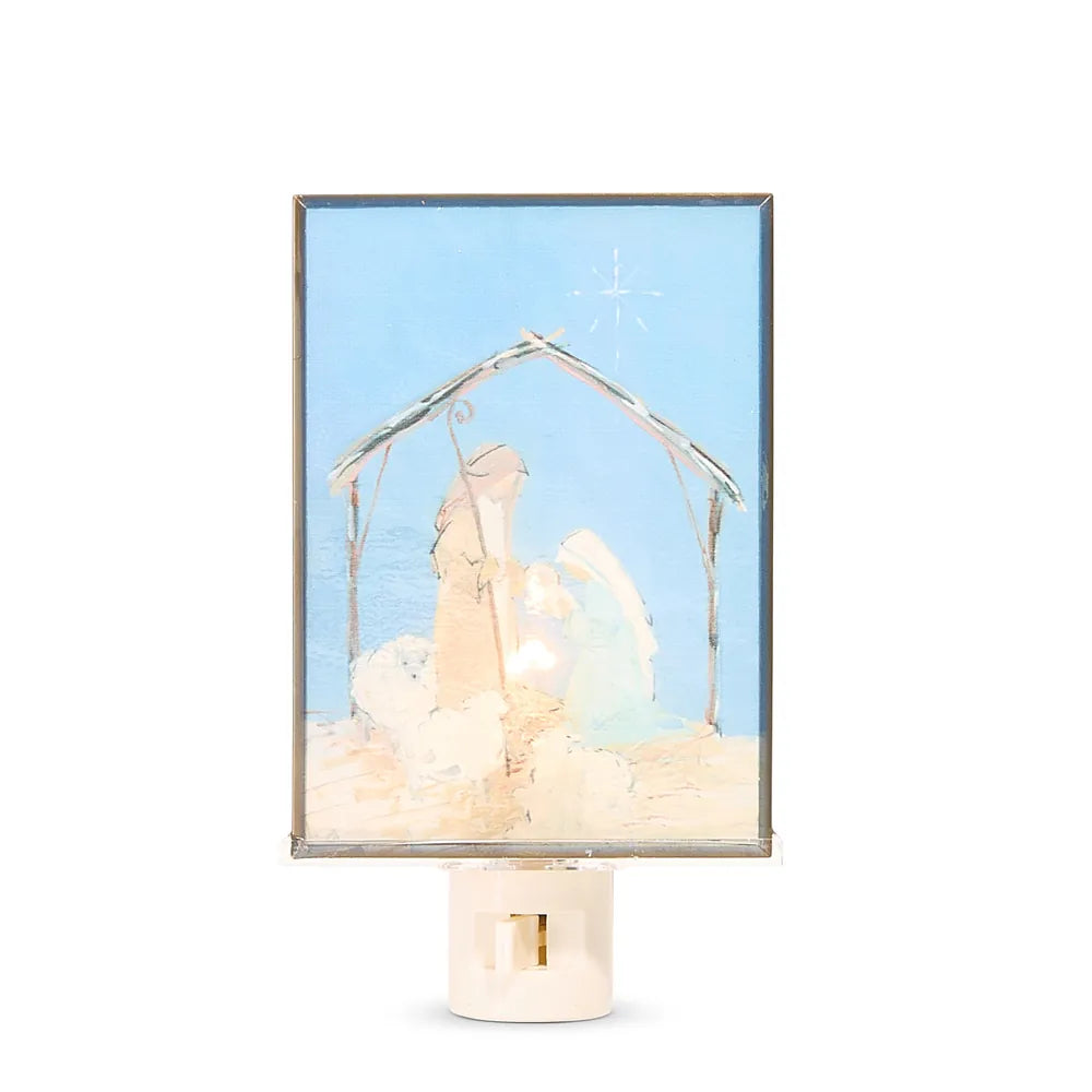Nativity scene night light plug-in with blue glass panel and holy family silhouette