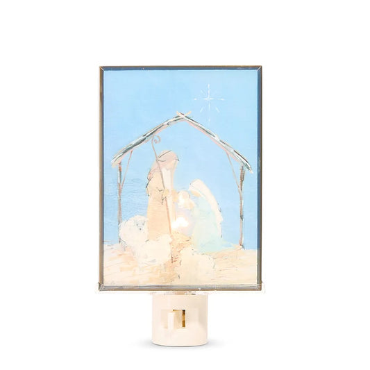 Nativity scene night light plug-in with blue glass panel and holy family silhouette