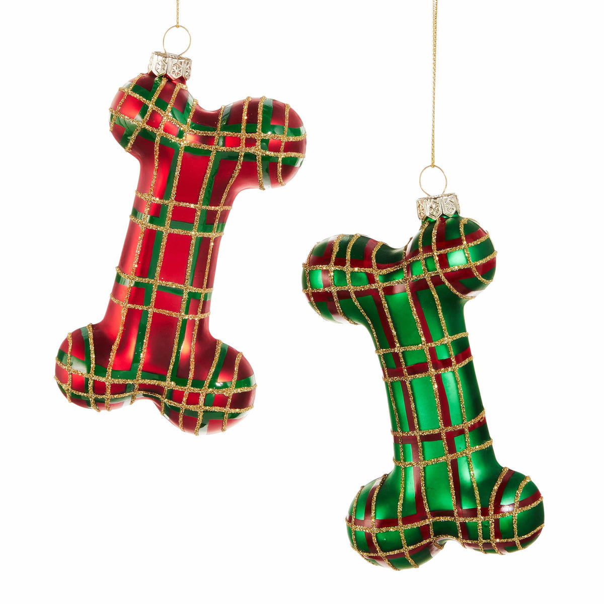 Two glass dog bone-shaped Christmas ornaments with red and green plaid pattern and gold glitter grid lines