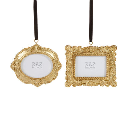 Two ornate gold vintage-style photo frame ornaments with black ribbon hangers, oval and square