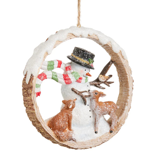 Snowman ornament in wood slice ring with deer bear and bird winter scene
