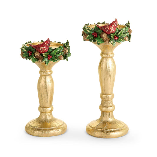 Pair of gold pillar candlesticks with cardinal bird and holly wreath decoration, two sizes