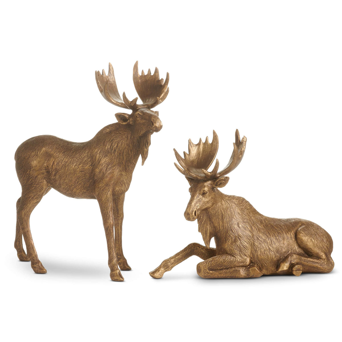 Two antique gold moose figurines, one standing and one resting, with large palmate antlers