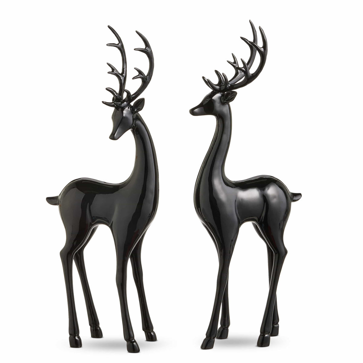 Pair of glossy black deer figurines with antlers standing upright, facing each other