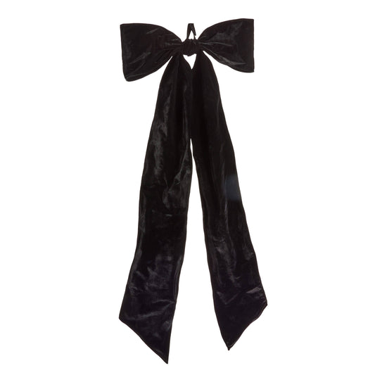 Large oversized velvet bow with two wide loops and long flowing ribbon tails, front view