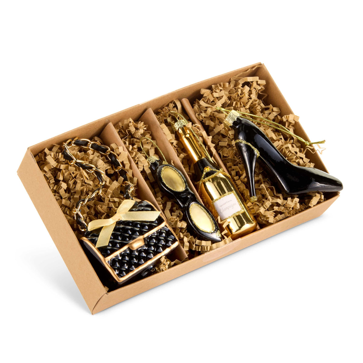 Gift box set of four glamour-themed ornaments including purse, sunglasses, champagne bottle, and high heel