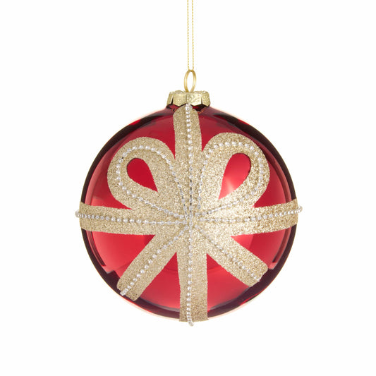 Shiny red glass ball ornament with gold glitter bow and pearl bead ribbon detail, hanging view