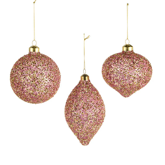 Three pink and gold glitter Christmas ornaments in ball, finial, and onion shapes