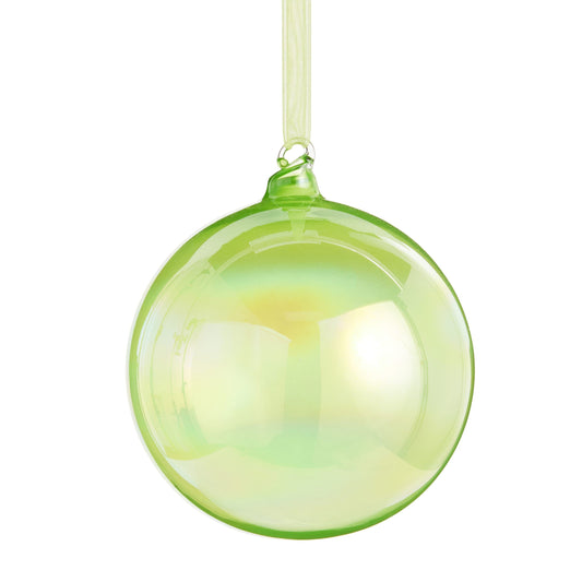 Glossy iridescent lime green glass ball ornament hanging from a sheer ribbon, front view