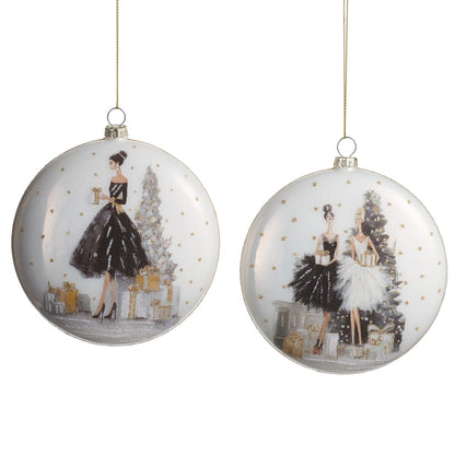 Two flat glass disc Christmas ornaments with elegant fashion figures, black and white gowns, gold accents