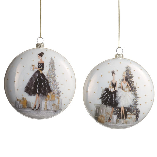 Two flat glass disc Christmas ornaments with elegant fashion figures, black and white gowns, gold accents