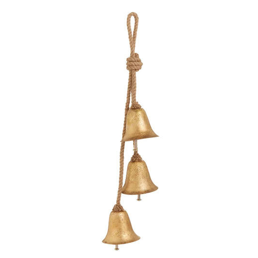 Three gold metal bells hanging on twisted jute rope in cascading cluster arrangement