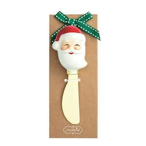 Santa Claus face cheese spreader with gold metal blade on kraft paper gift card