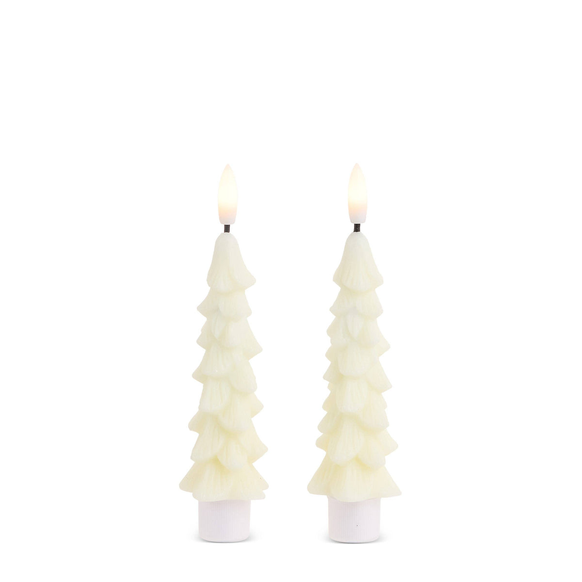 Pair of ivory Christmas tree-shaped taper candles with lit flames, set in white holders