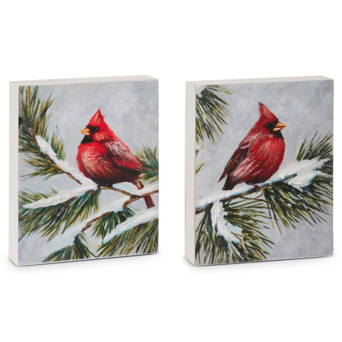 Two rectangular wall blocks painted with red cardinal birds perched on snow-covered pine branches