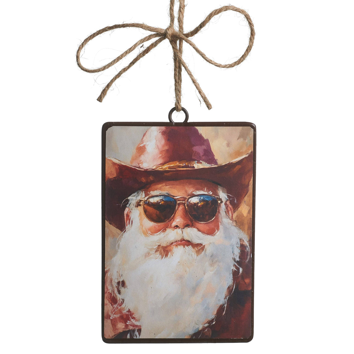 Rectangular metal ornament with painted cowboy Santa wearing sunglasses and hat, hung with jute twine bow