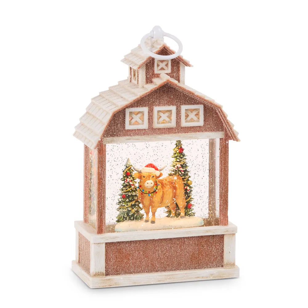 Red barn-shaped water lantern with Highland cow Santa hat glitter snow globe interior