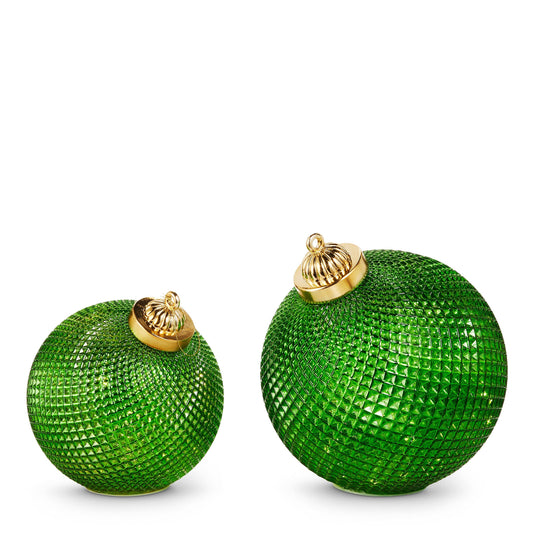 Two green textured glass lighted orbs with gold caps, small and large sizes