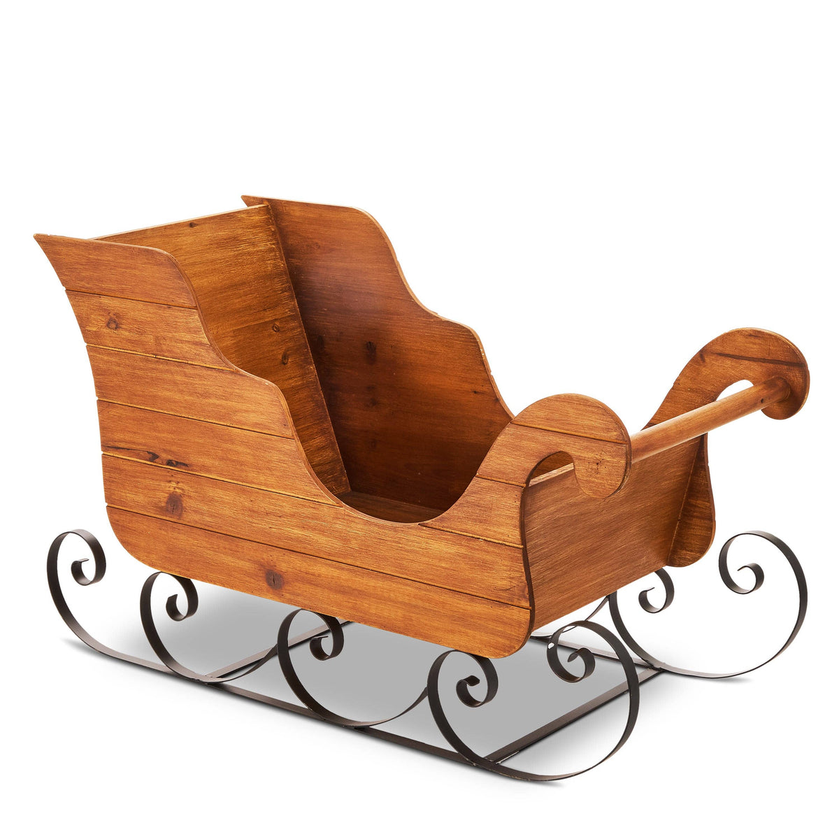 Wooden decorative sleigh with scrolled black metal runners, angled front view showing interior