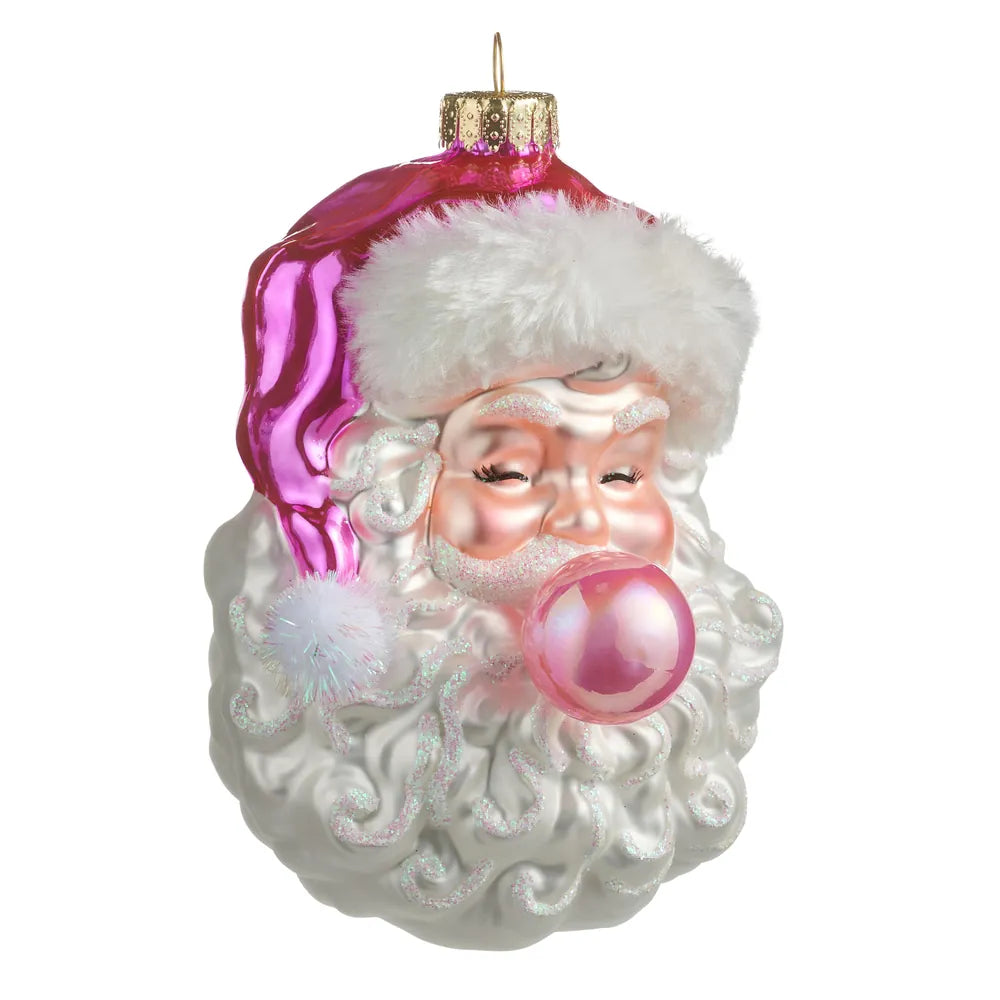 Glossy pink Santa face glass ornament with white beard blowing a pink bubble