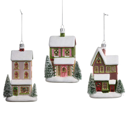Set of three glass house Christmas ornaments with snow-covered roofs and miniature bottle brush trees