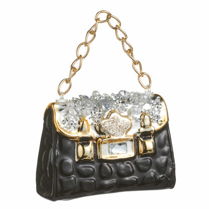 Quilted black purse ornament with gold chain handle and crystal jewel embellishments, angled view