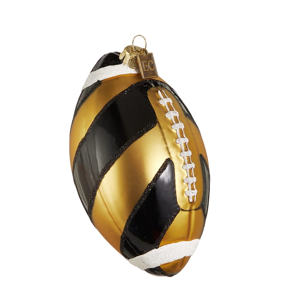 Gold and black striped glass football ornament with white laces and glitter accents