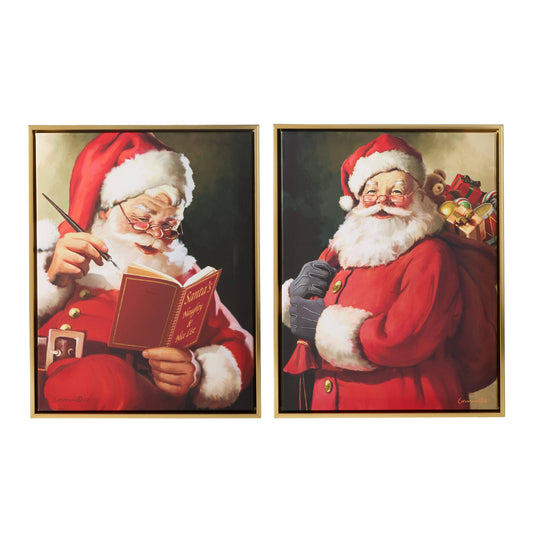 Two framed Santa Claus wall art prints in gold frames, checking naughty and nice list and delivering gifts