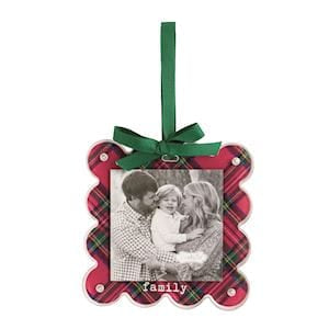 Red tartan photo ornament with green ribbon bow, displaying black-and-white family photo