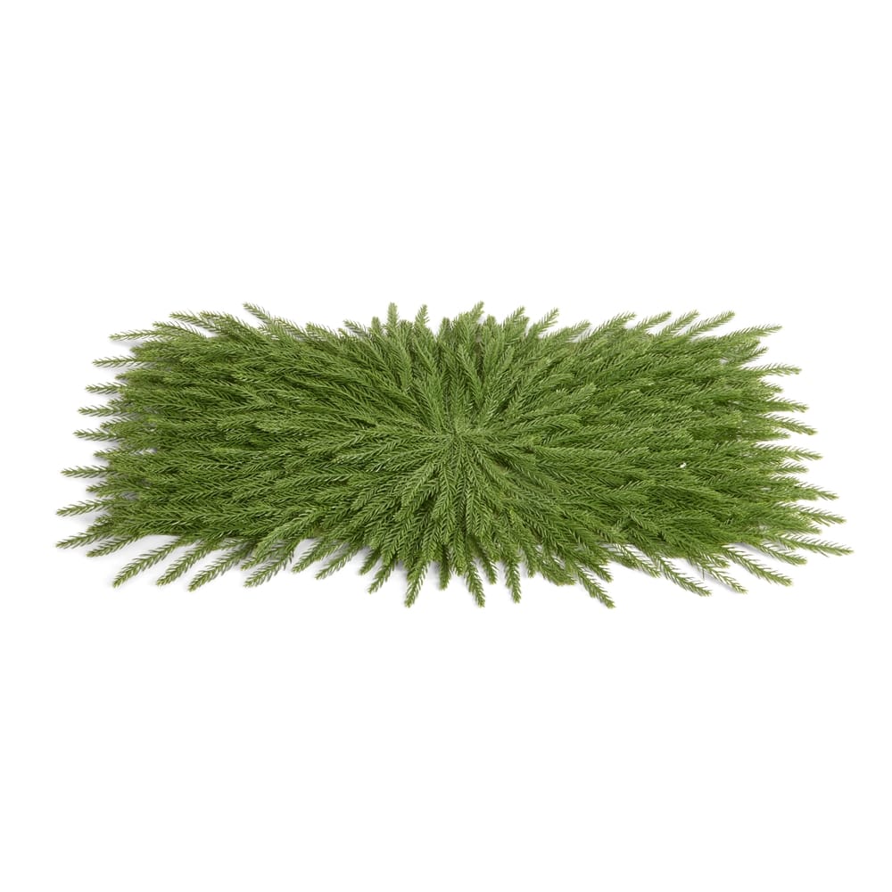 Artificial cedar branch placemat in dark green, 30.5 inches wide, flat lay view