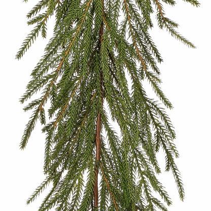 Cascading artificial fir garland with soft needle branches and brown stems, front view