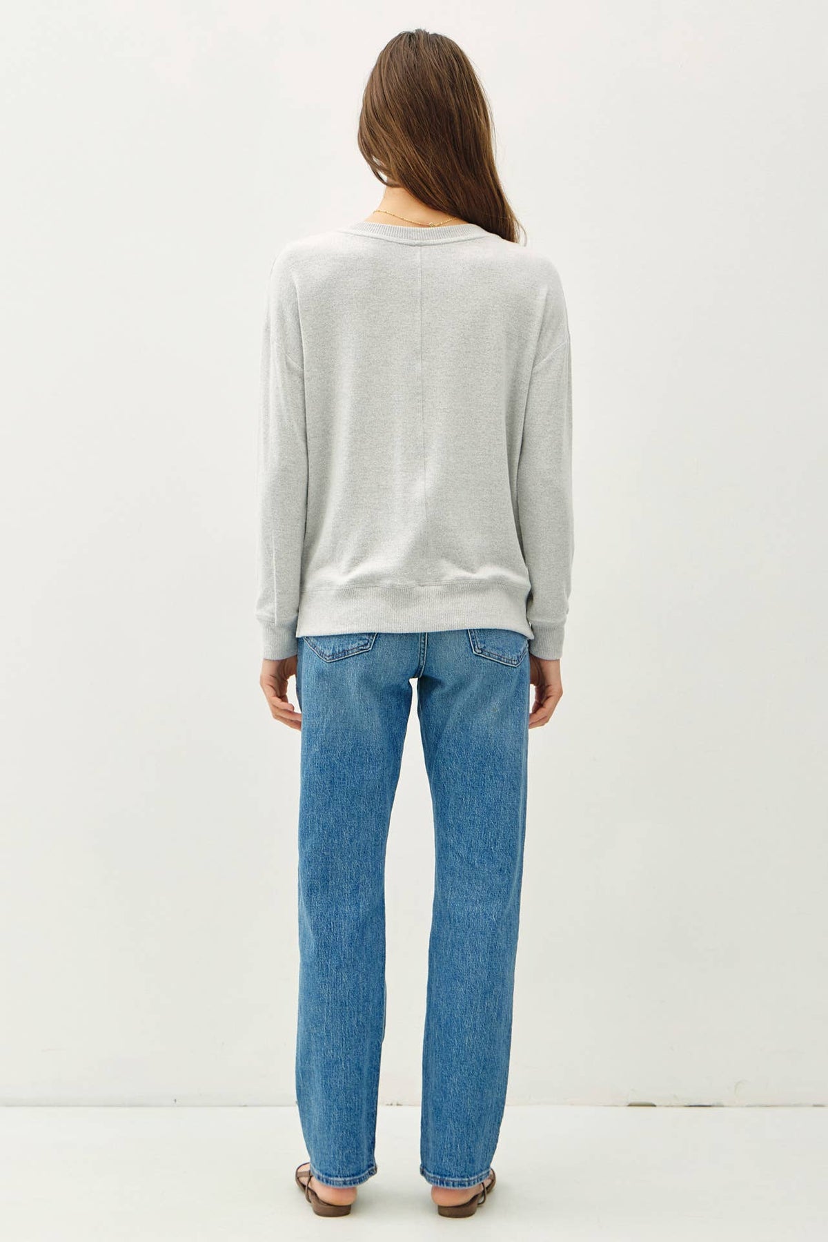 Light gray brushed hacci pullover knit top with long sleeves, back view