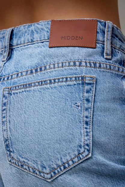 Light wash blue denim Bermuda shorts with brown leather Hidden brand patch