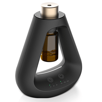 Candyl Delta black waterless essential oil diffuser with amber glass bottle and gold nozzle