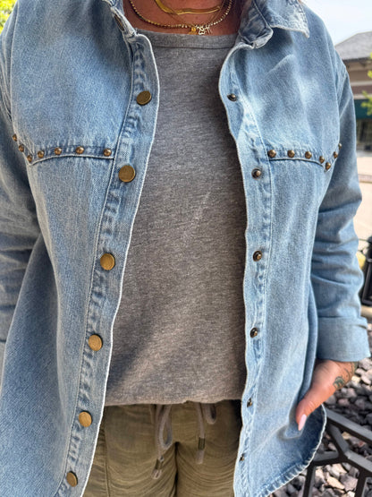 Light wash denim shirt with gold snap buttons and stud trim detail