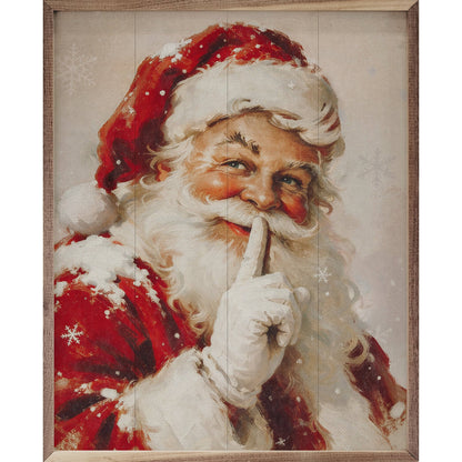 Framed painting of Santa Claus holding finger to lips with snowflakes
