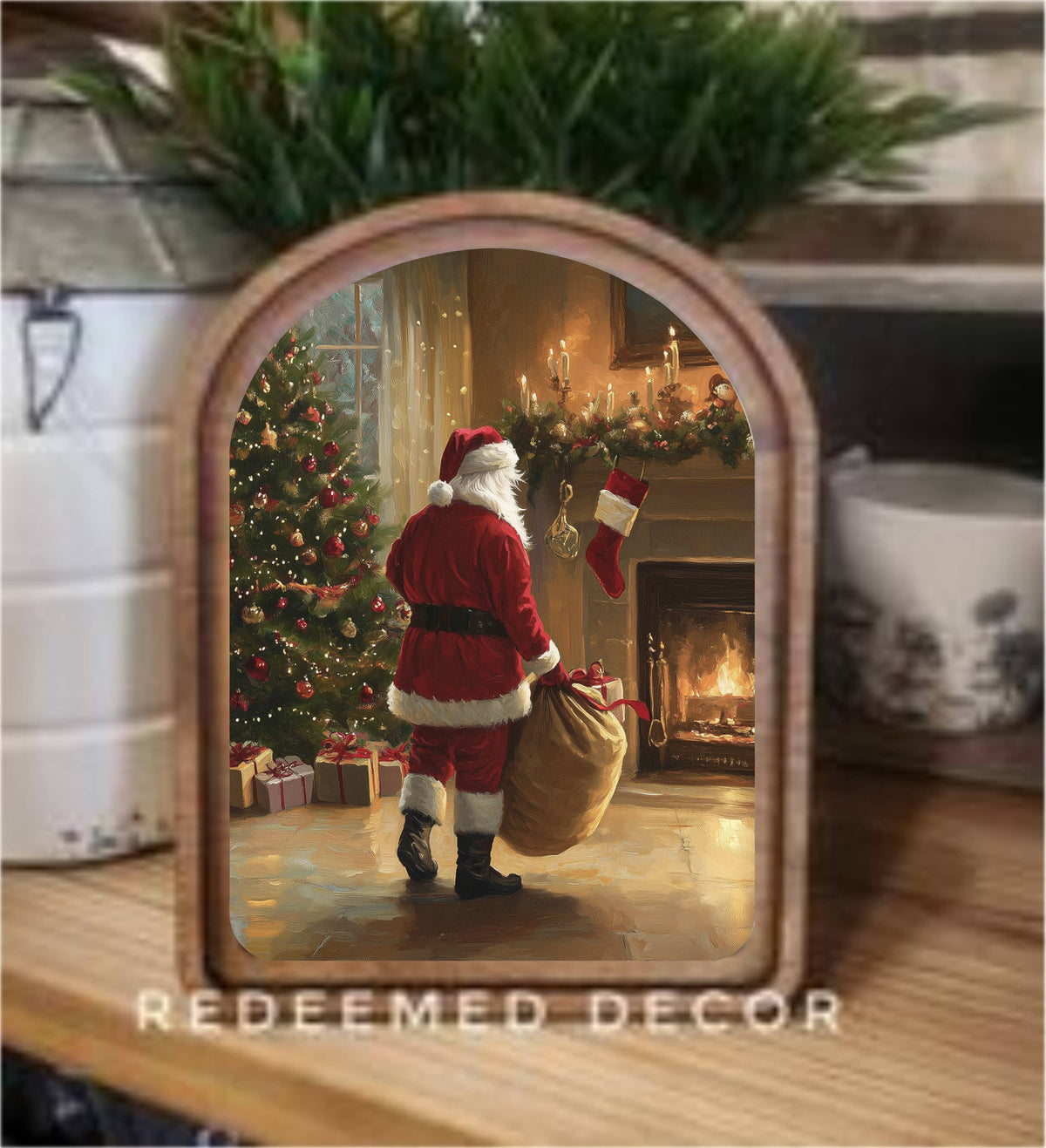 Arch-framed wood art print of Santa Claus by a fireplace and Christmas tree