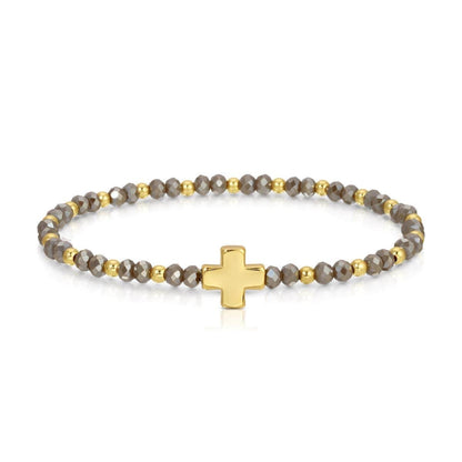 Gray faceted crystal and gold bead stretch bracelet with gold cross centerpiece